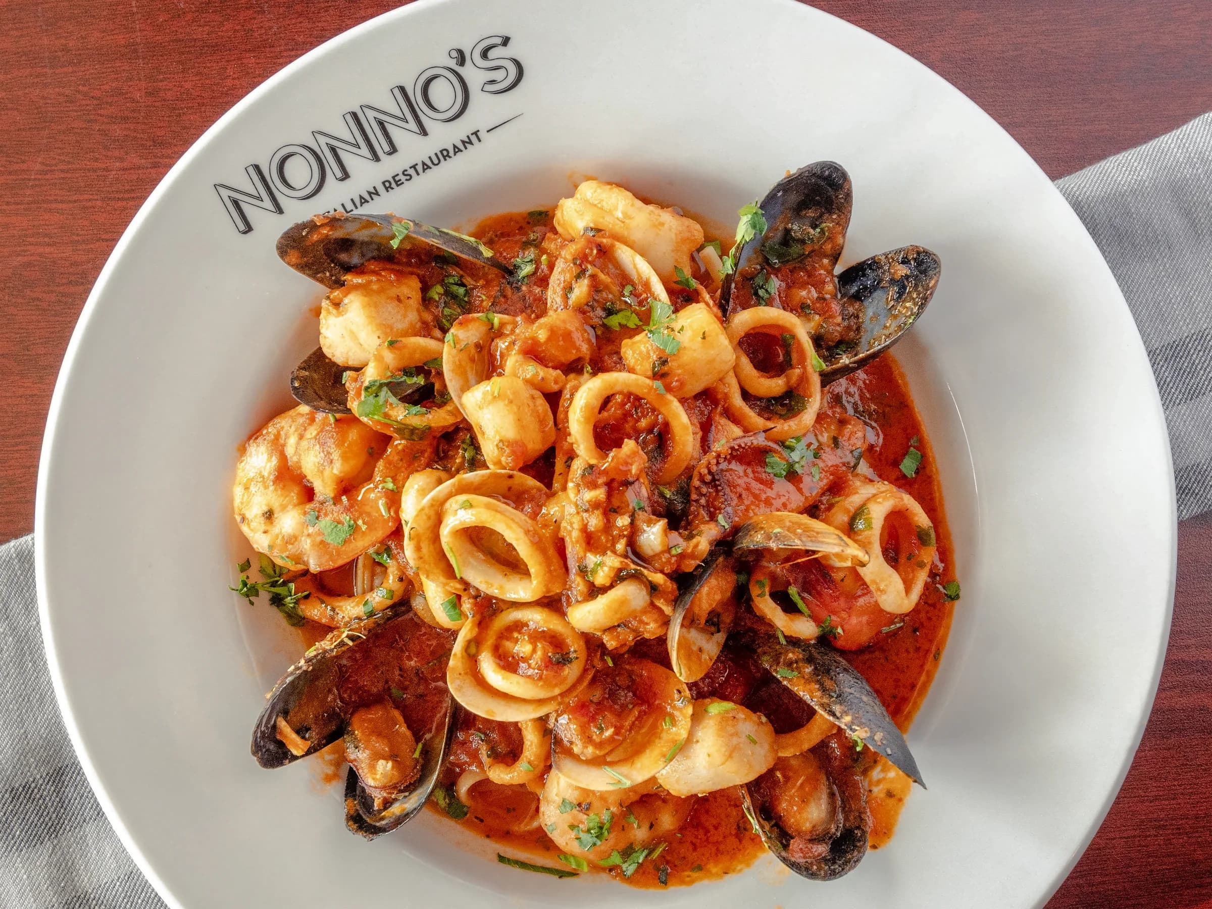 Zuppa di Mare with mussels, calamari, and shrimp in marinara