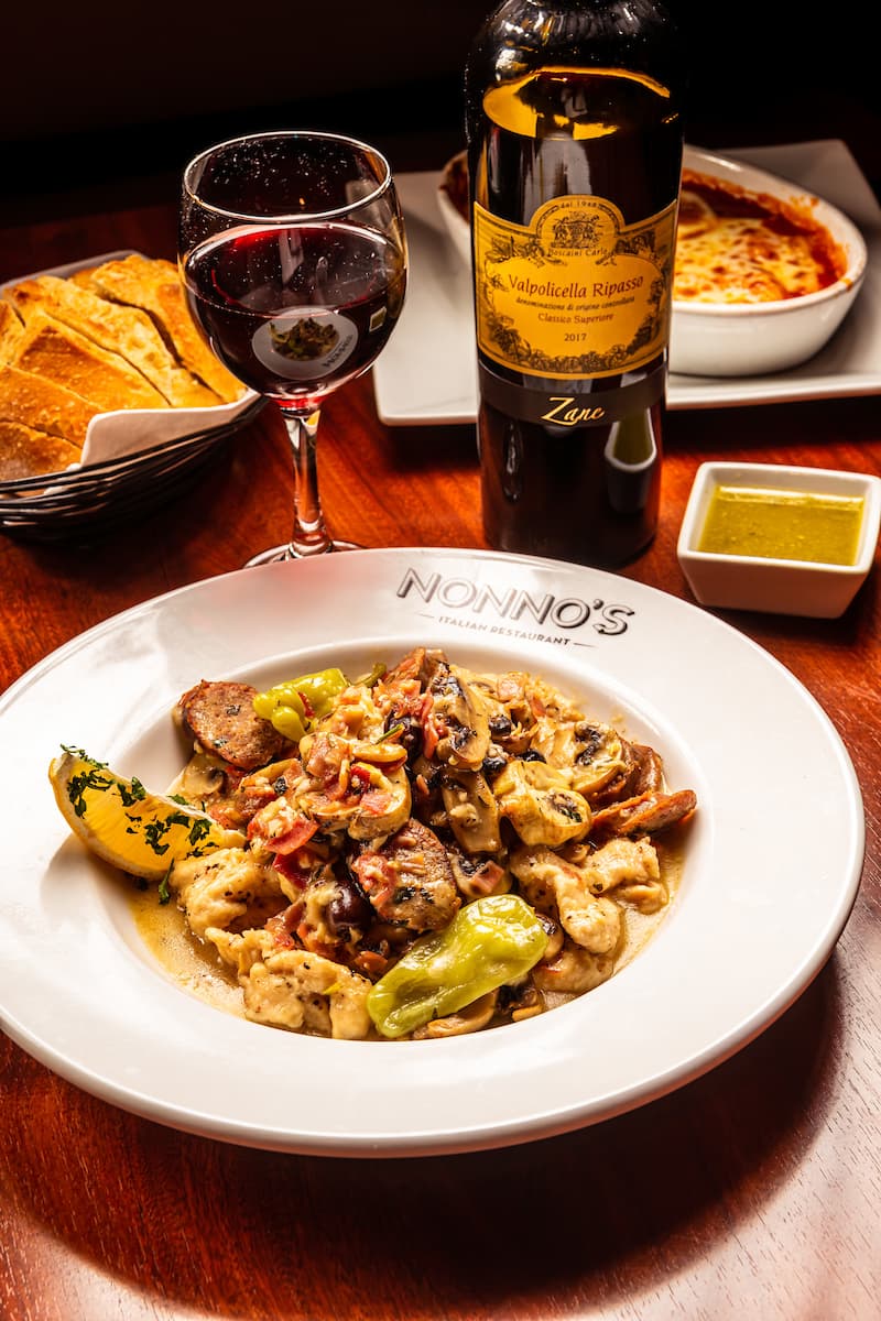 Pollo di Stefano with chicken, sausage, and prosciutto on a Nonno's plate