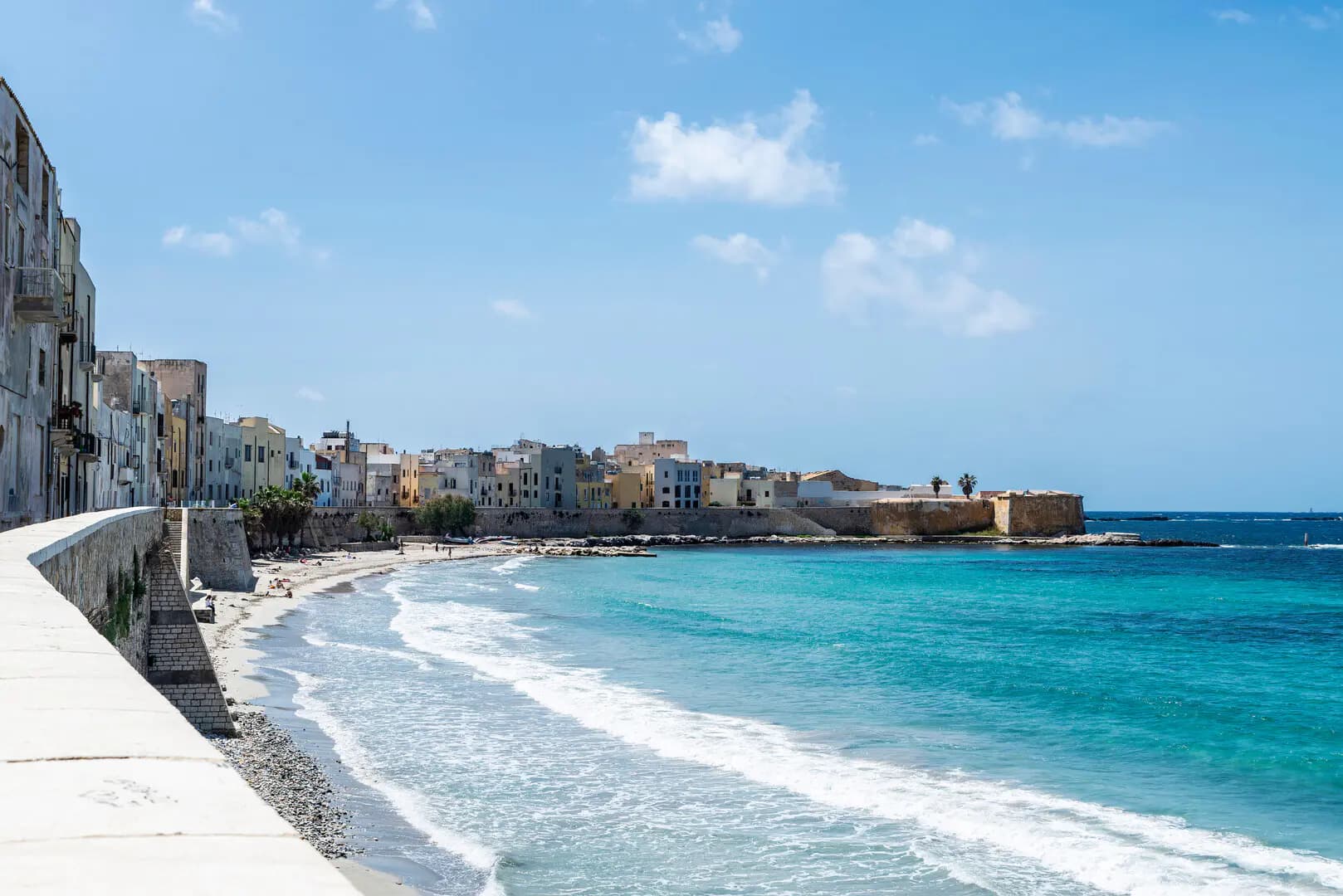Marsala waterfront in Sicily, with the historic town and turquoise sea